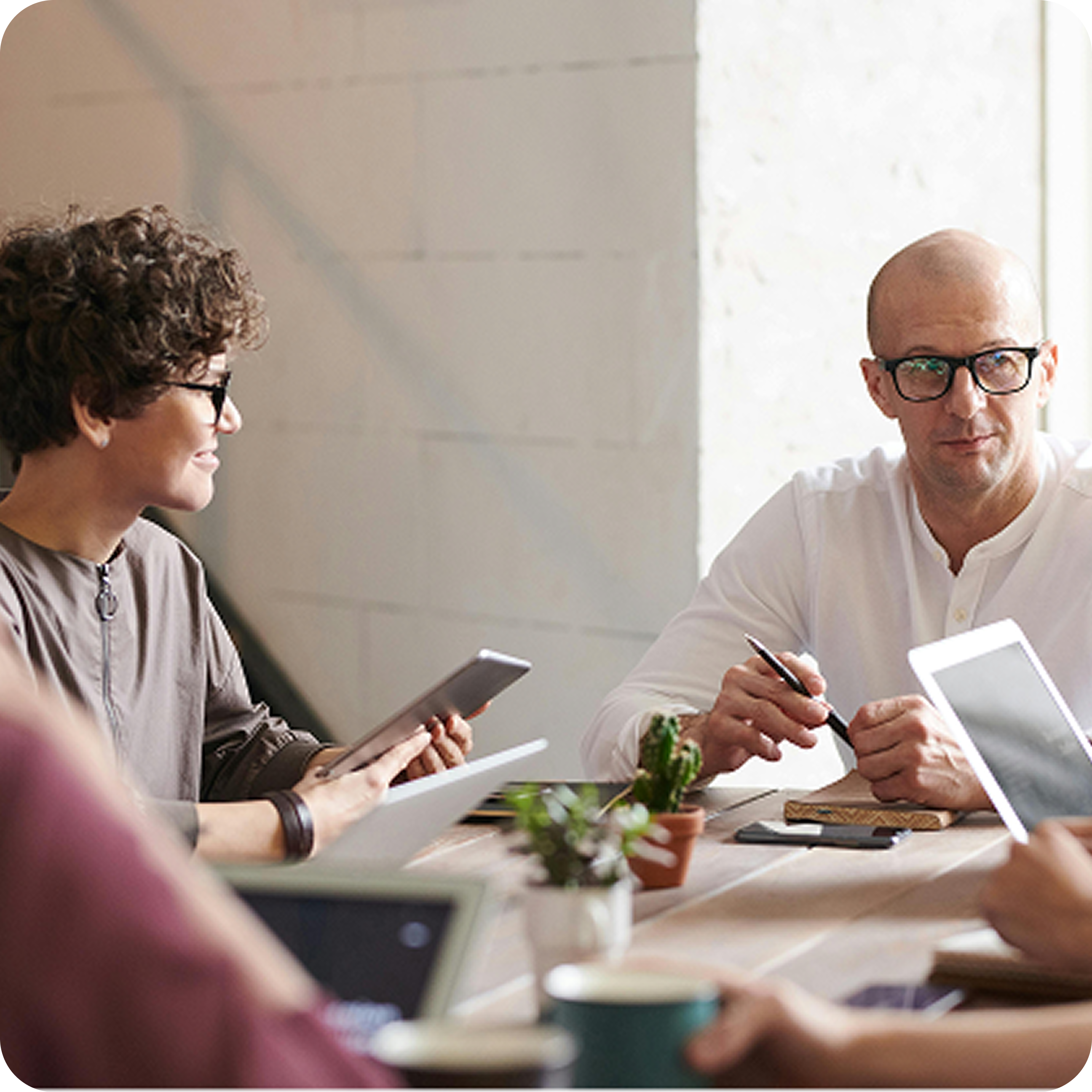 The people at the table are interested in listening to the idea